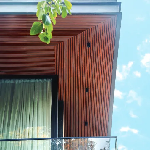 Corten louver blades with warm light